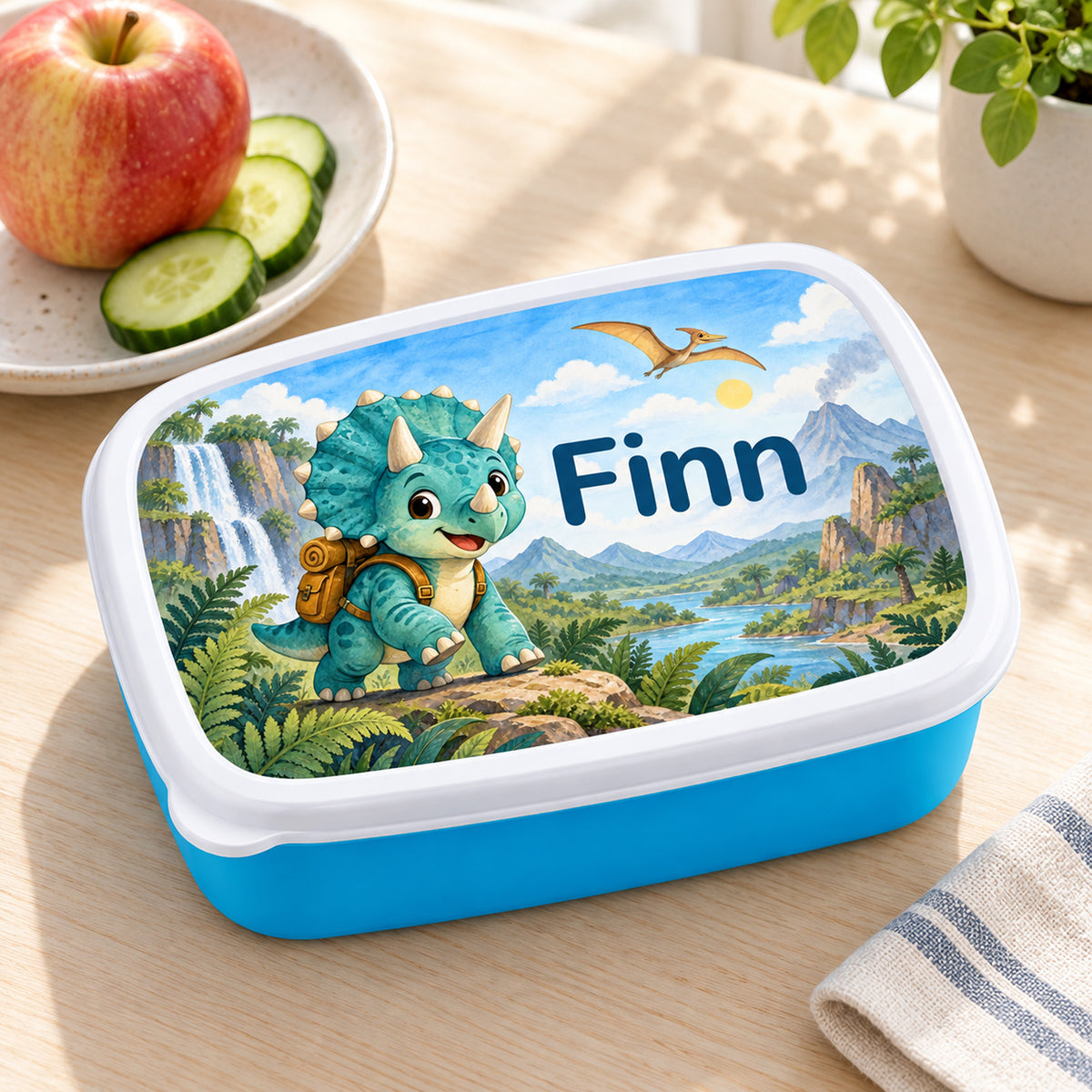 Personalisierte blaue Brotdose Dino-Entdecker mit Beispielname Finn: Pausenszene