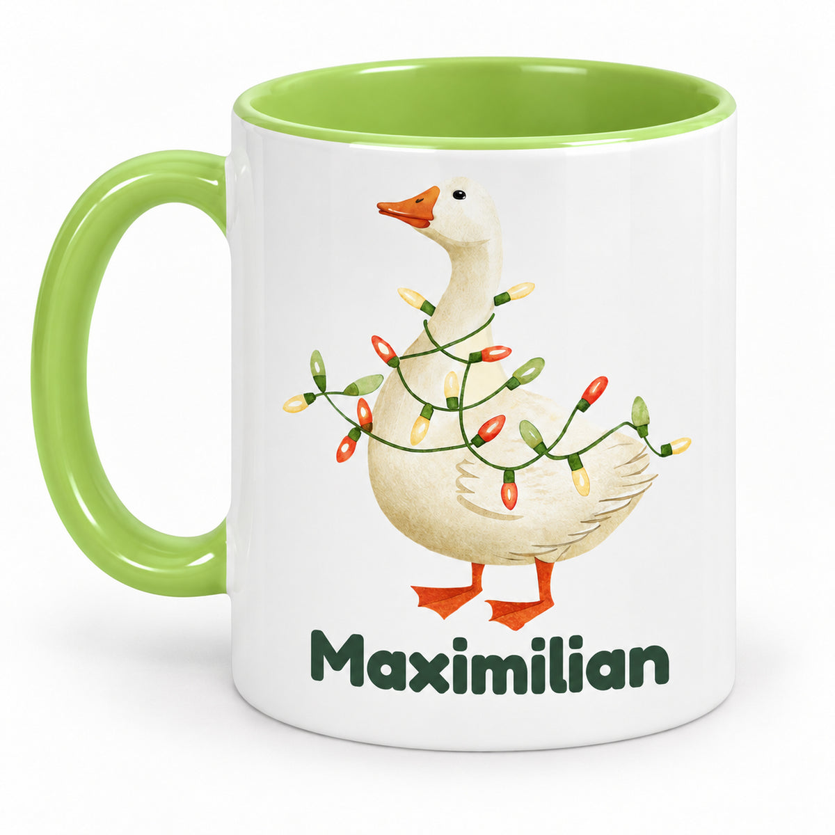 Rückansicht derselben hellgrünen Tasse mit Gans mit Lichterkette und Beispielname Maximilian