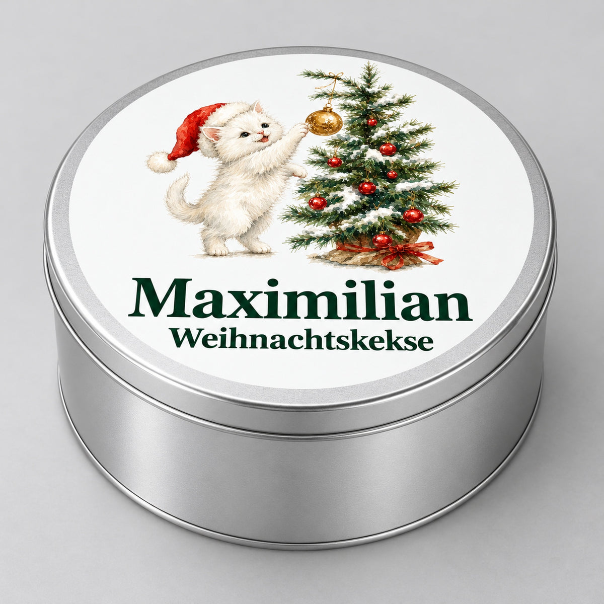 Seitenansicht einer runden Keksdose mit Katze, die nach einer goldenen Kugel am Weihnachtsbaum greift und Wunschname.