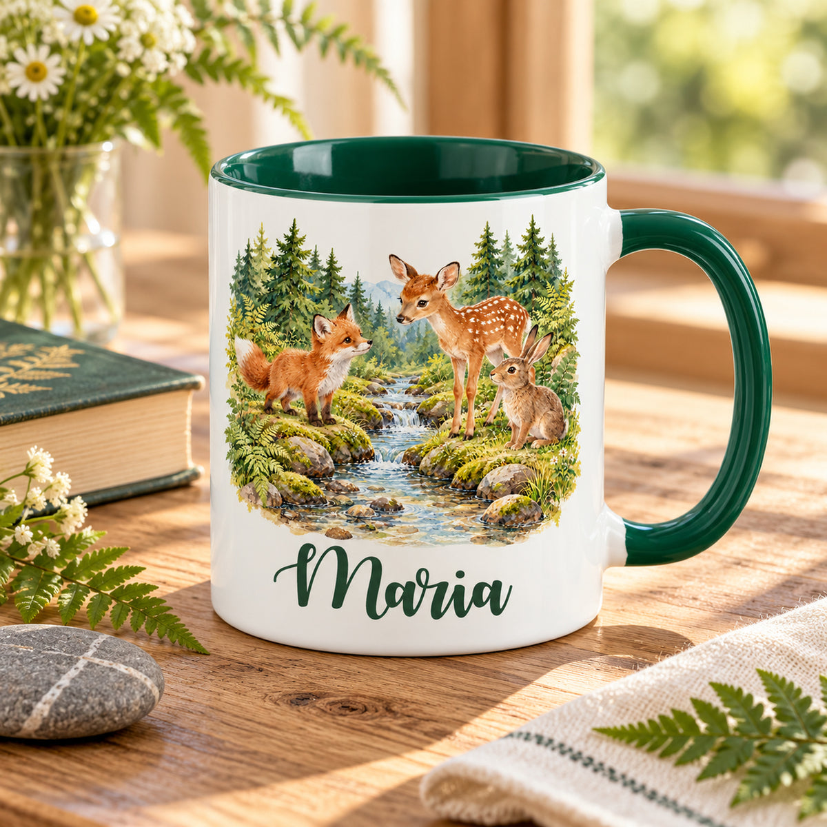 Namenstasse mit Fuchs, Rehkitz und Hasen am Bach auf einem Holztisch neben Buch und Naturdekoration.