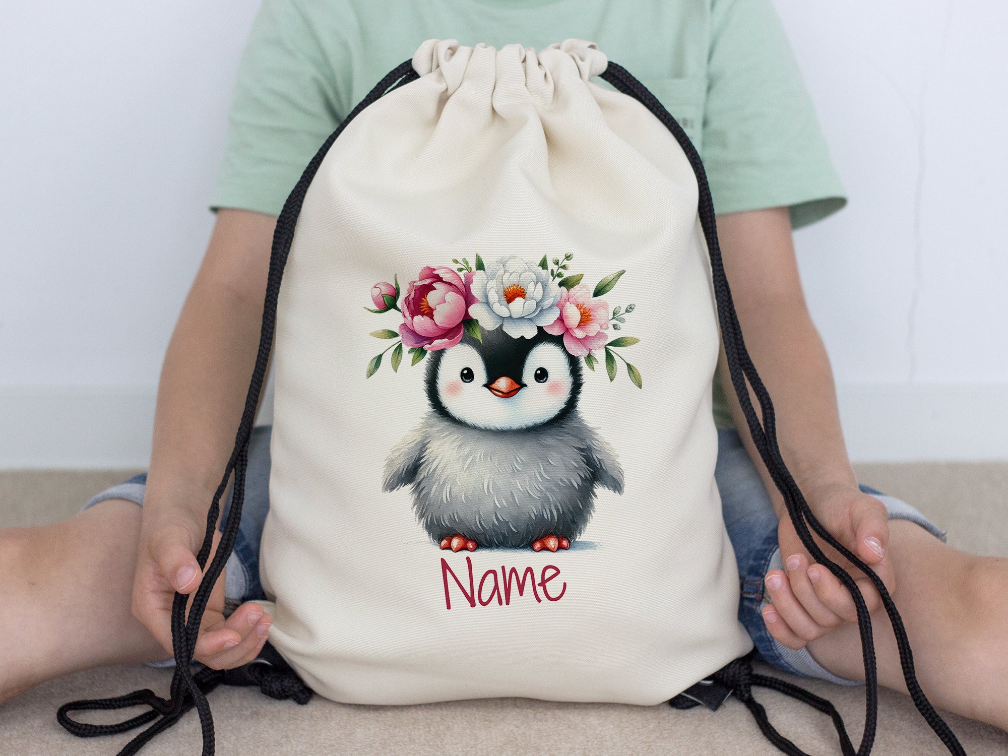 Turnbeutel mit Pinguin und Blumen
