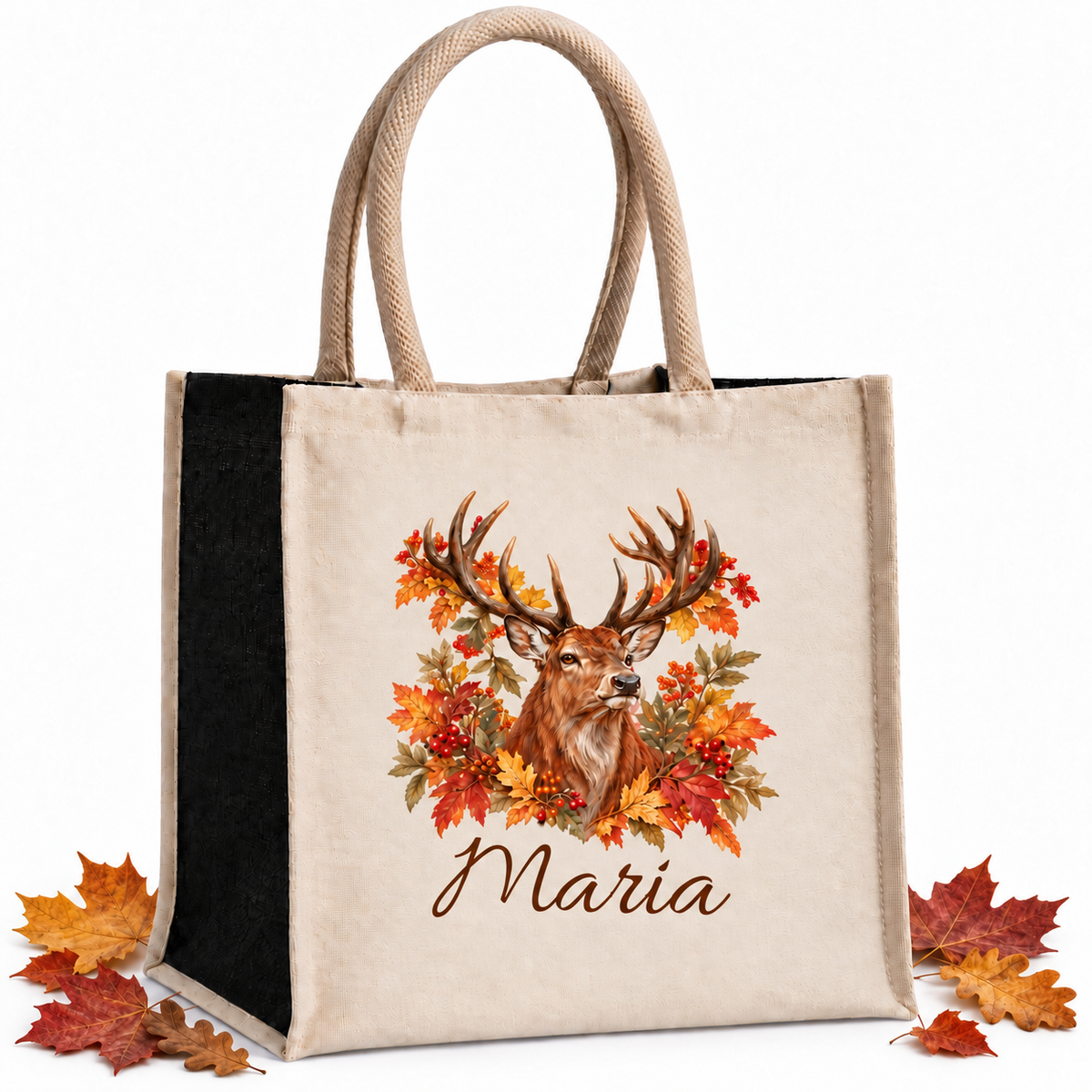 Einkaufstasche mit herbstlichem Hirsch-Motiv und Wunschname mit herbstlichen Blättern als Dekoration auf weißem Hintergrund.