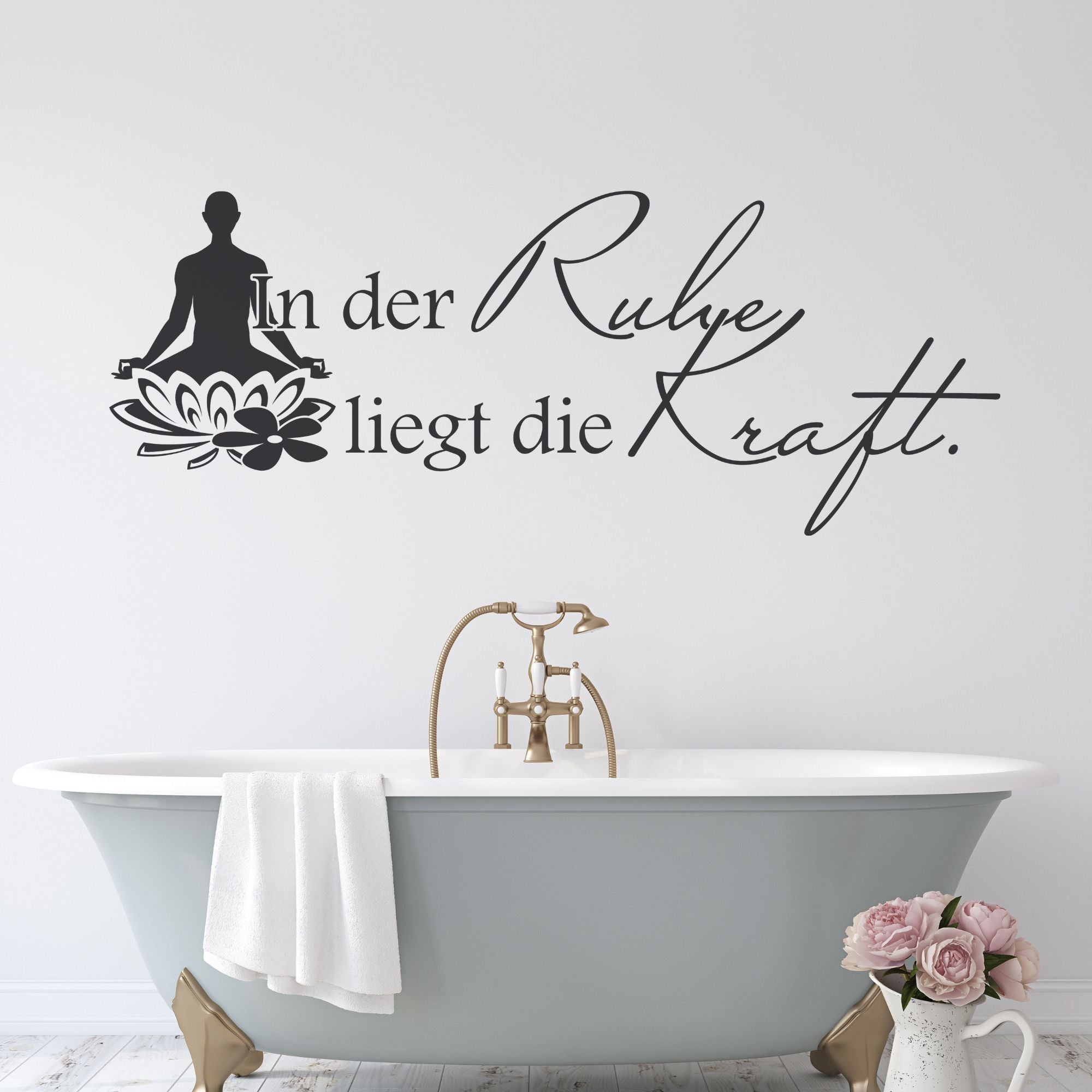 Wandtattoo mit Buddha und Schriftzug in Schwarz.