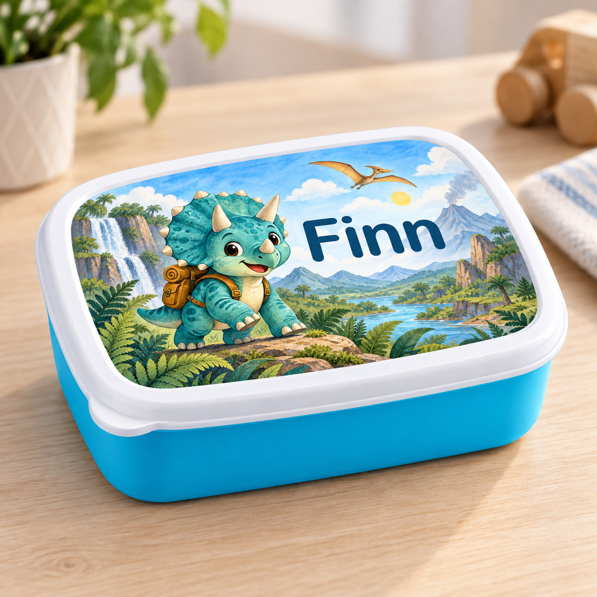 Personalisierte blaue Brotdose Dino-Entdecker mit Beispielname Finn: Schrägansicht