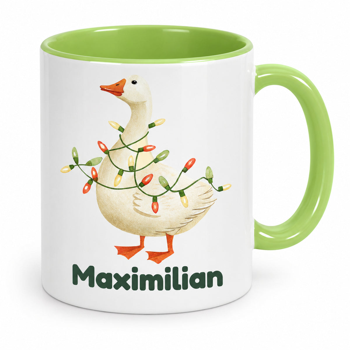 Hellgrüne Tasse mit Gans mit Lichterkette und Beispielname Maximilian in der Vorderansicht
