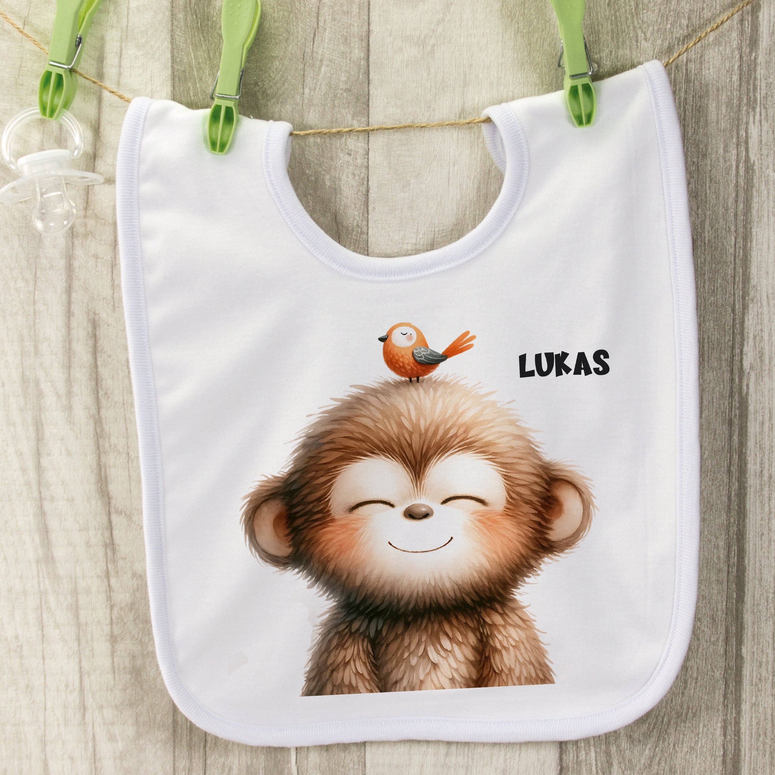 Lätzchen mit fröhlichem Affen