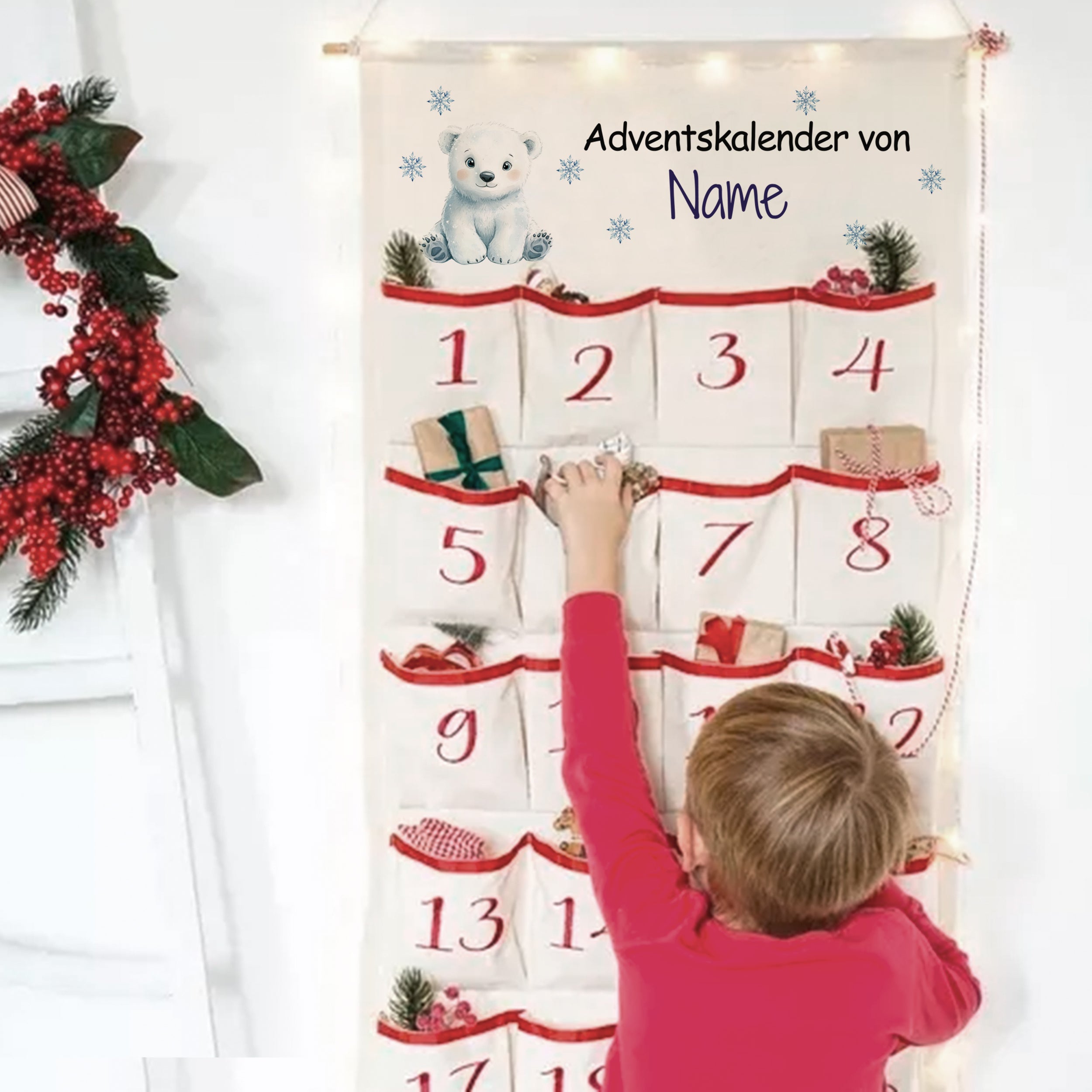 Adventskalender mit weißen Bär und roten Akzenten.