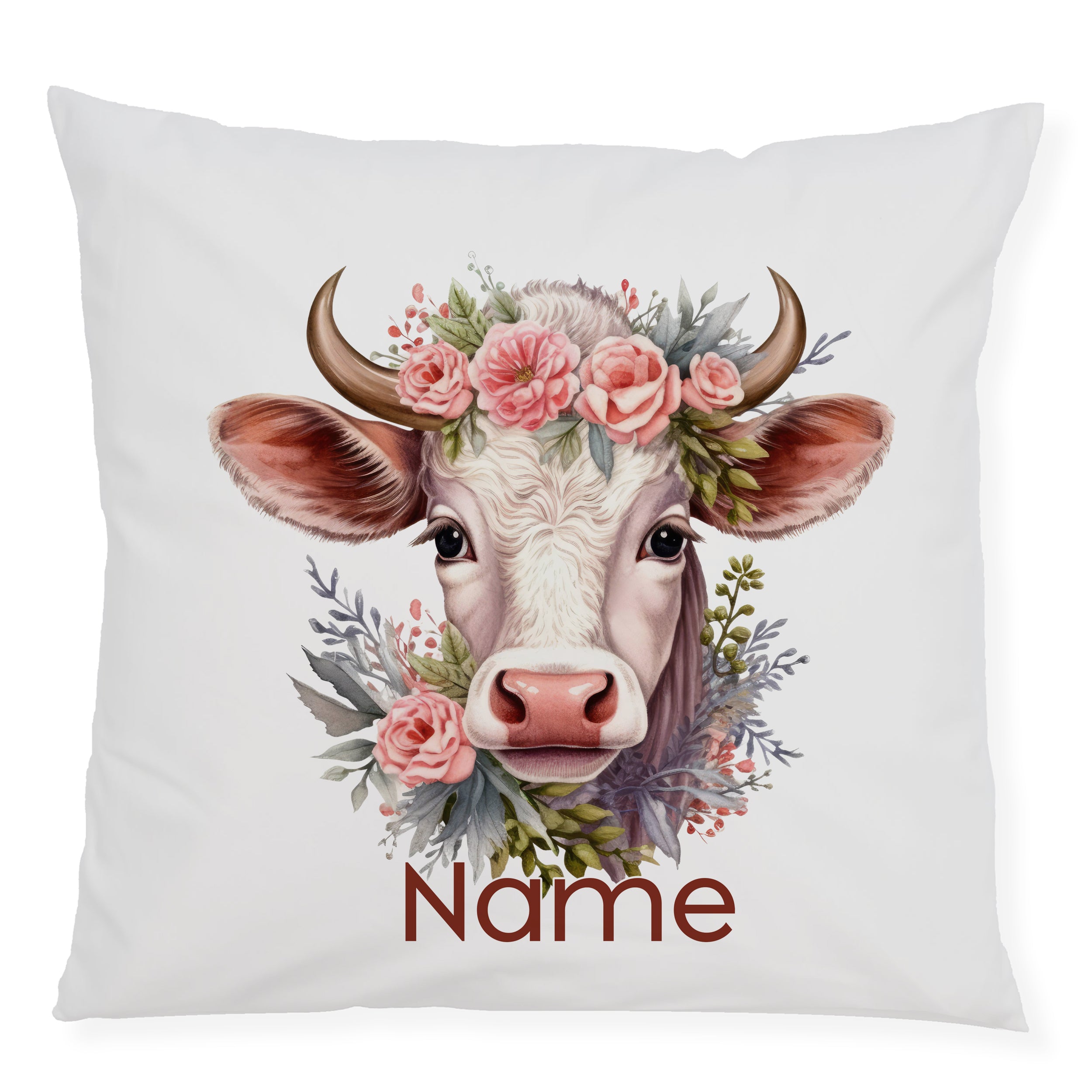 Kissen mit Kuhkopf, Blumenkranz und personalisiertem Namen.