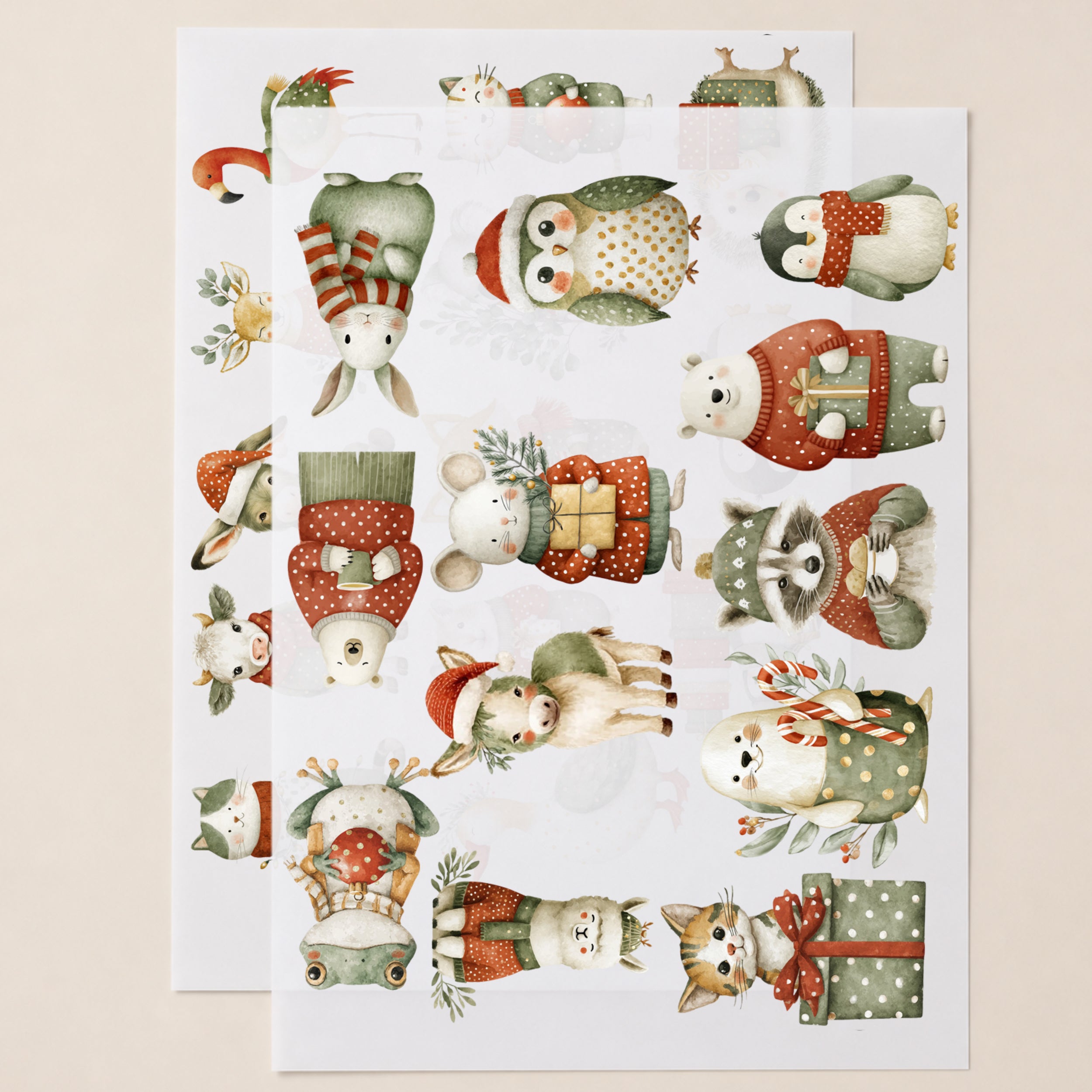 Zwei DIN-A4-Bögen mit weihnachtlichen Tier-Bügelbildern wie Pinguin, Fuchs, Hase, Katze und Rentier